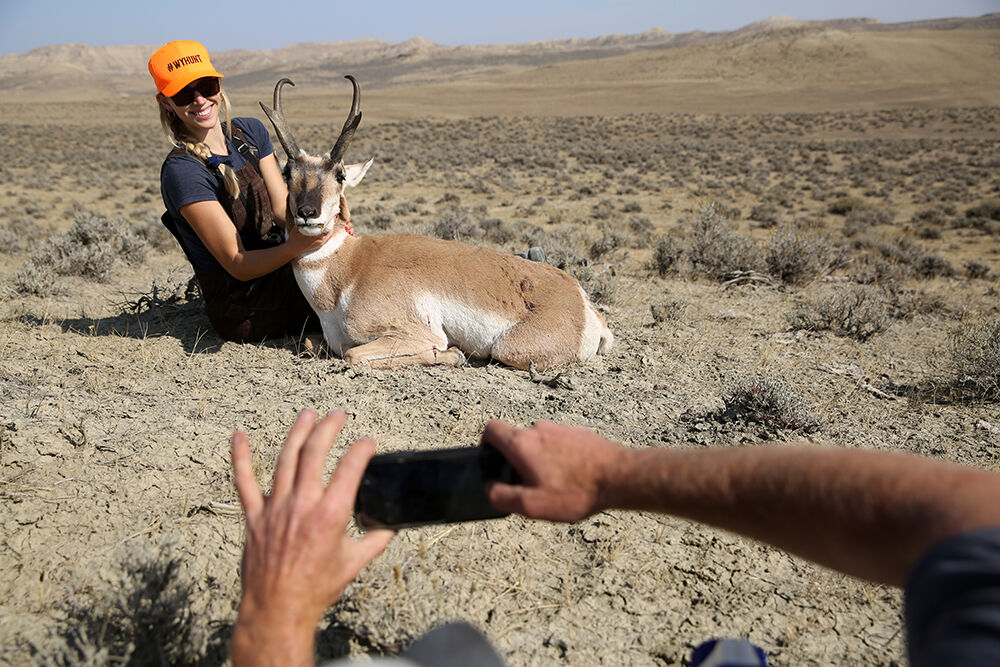 Tobey Schmidt posed with her buck on top of a hill